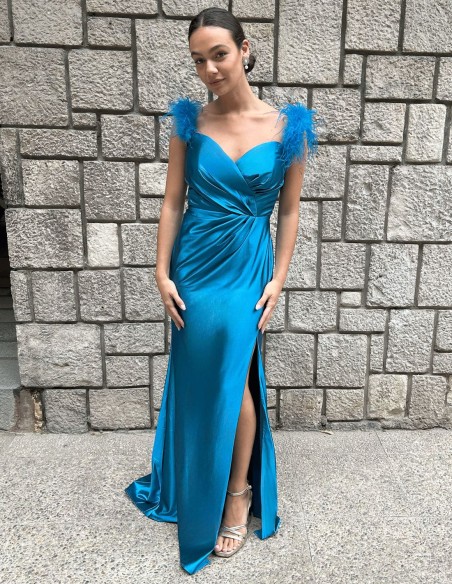 Party dress for guest with feathers on the shoulder