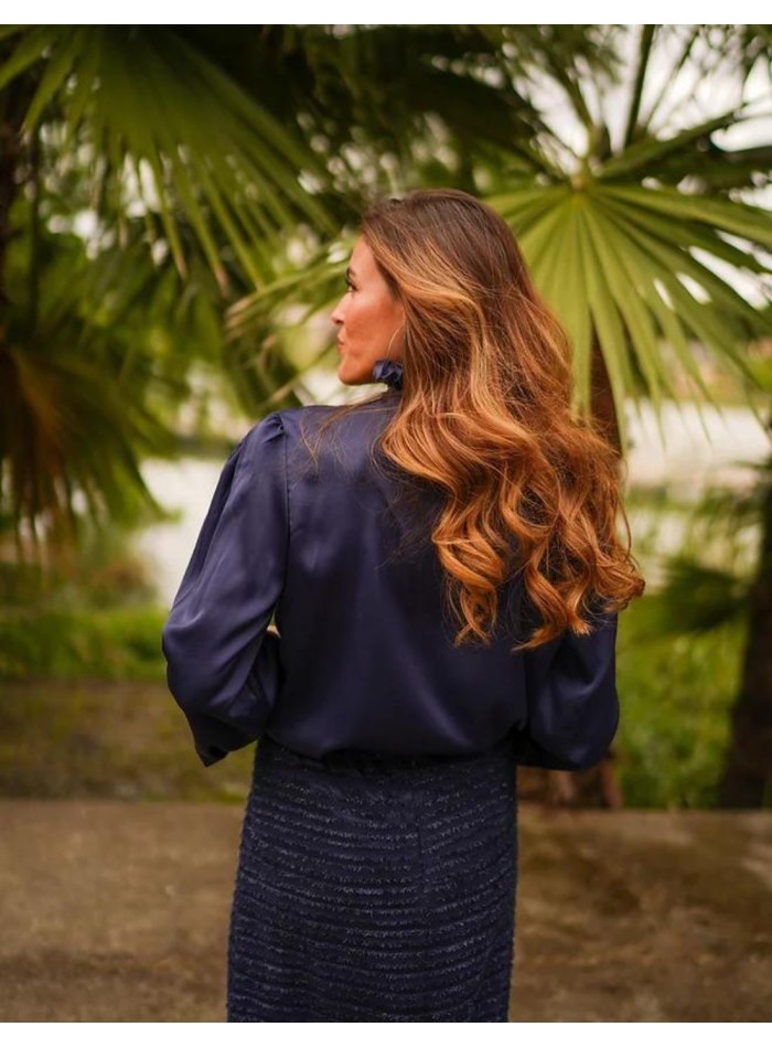 Navy blouse with shoulder pads and V-neckline