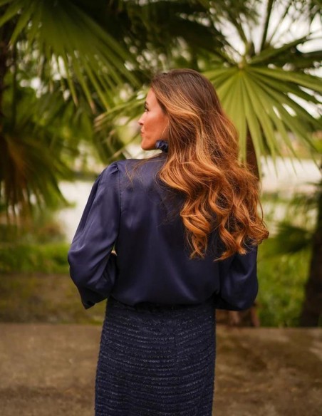 Navy blouse with shoulder pads and V-neckline