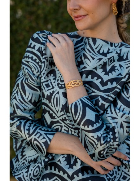 Blusa de fiesta con volante peplum estampado azul