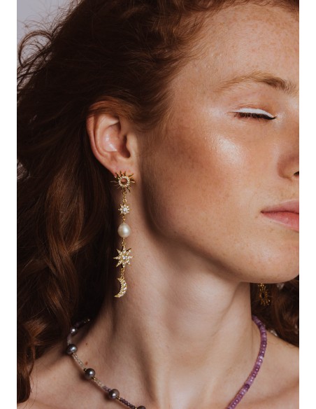 Long golden earrings with moons and stars