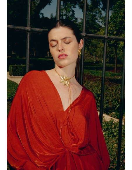 Golden necklace in the shape of lotus flower