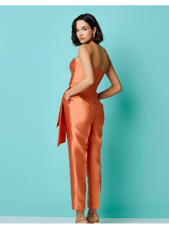 Long peach party jumpsuit with strapless neckline