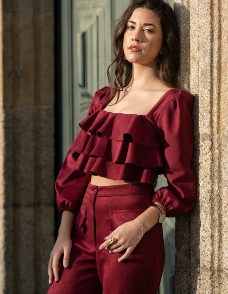 Party outfit with long pants and ruffled top