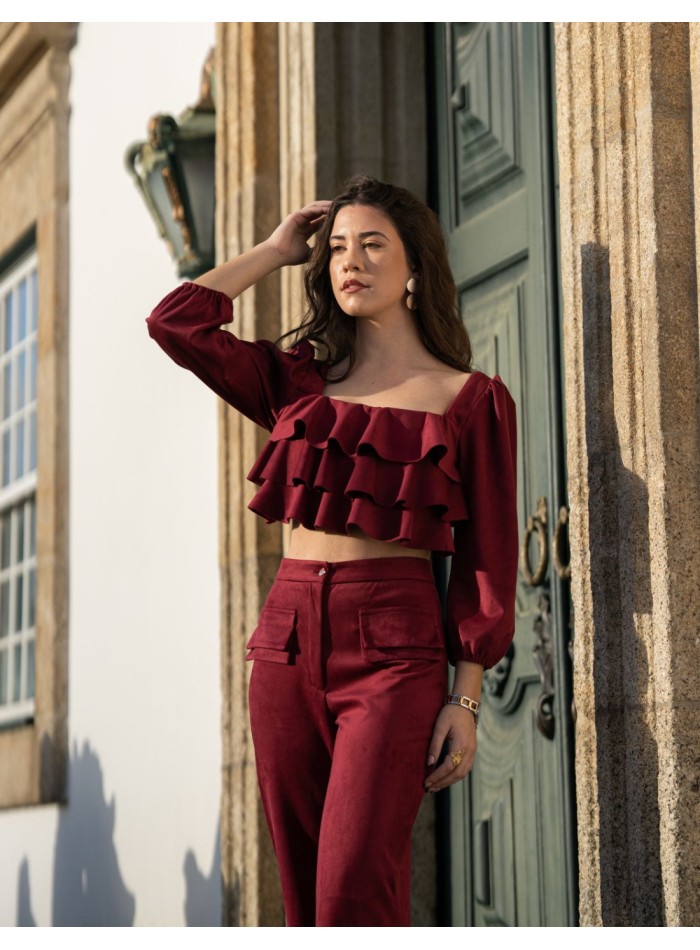 Party outfit with long pants and ruffled top