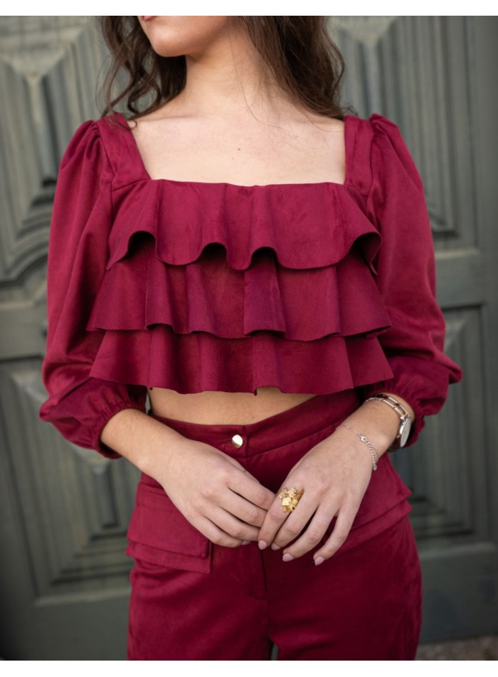 Party outfit with long pants and ruffled top