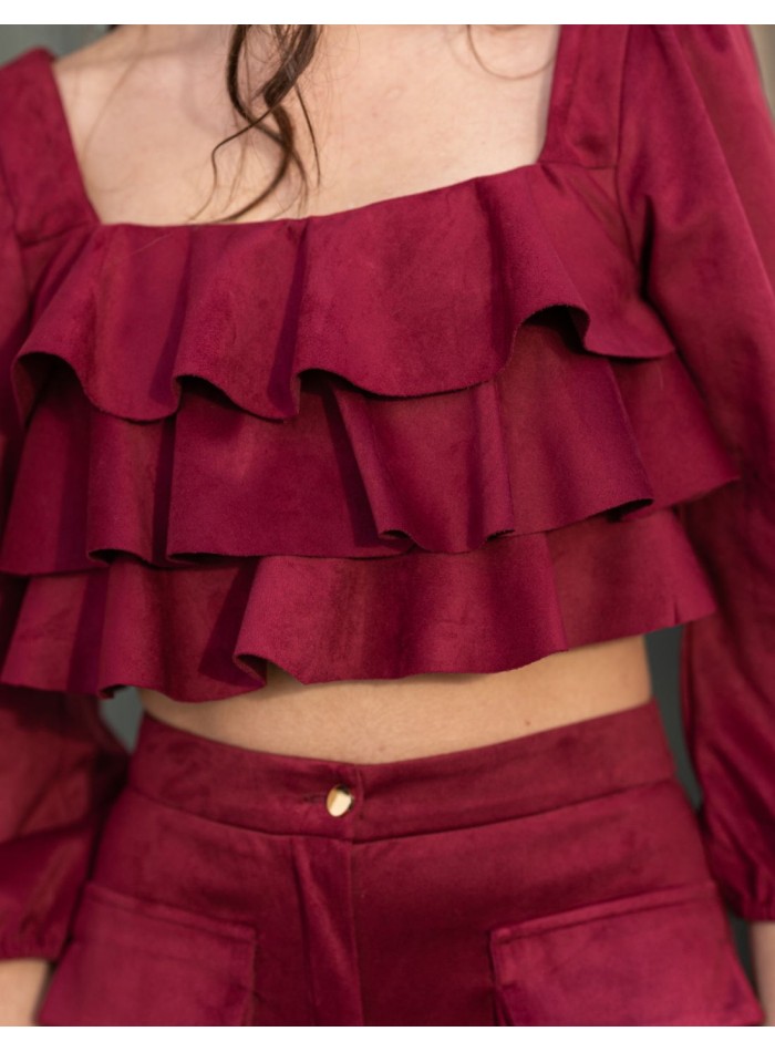 Party outfit with long pants and ruffled top