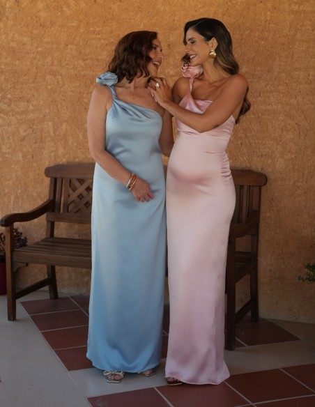 Asymmetrical long guest dress with flower on the shoulder