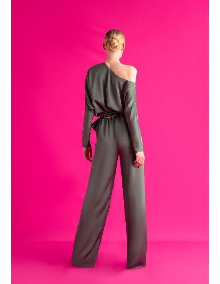 Asymmetrical satin green jumpsuit with bat sleeves and belt