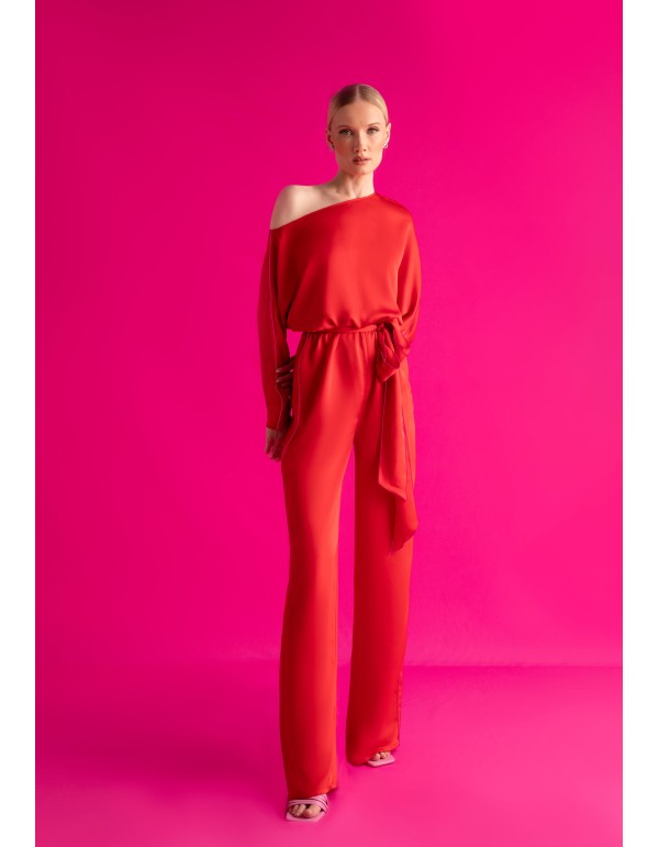 Asymmetric red jumpsuit with bat sleeves and belt 2