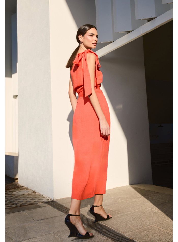 Orange asymmetrical top with lacing on the...