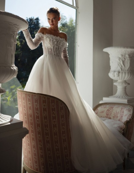 Long ivory wedding dress with lace neckline and rhinestones