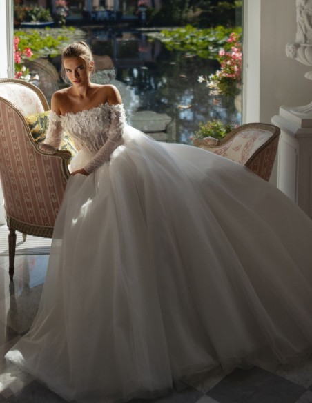 Long ivory wedding dress with lace neckline and rhinestones