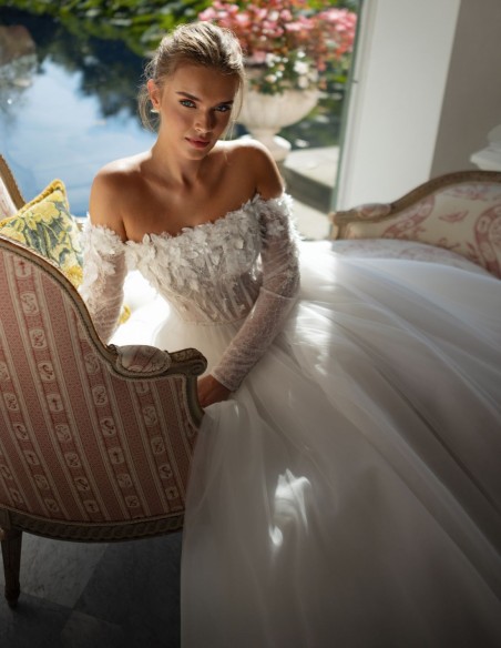 Long ivory wedding dress with lace neckline and rhinestones