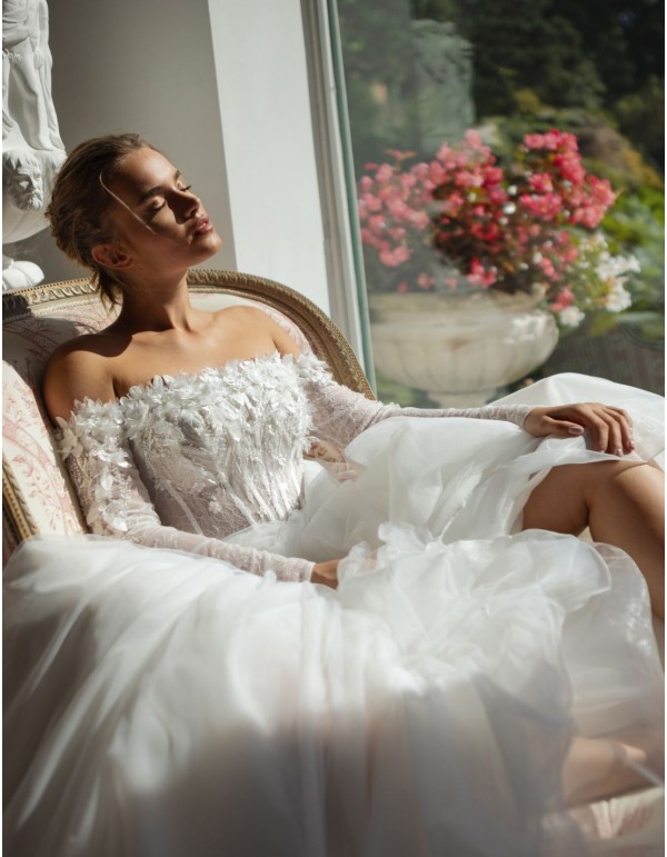 Long ivory wedding dress with lace neckline and rhinestones