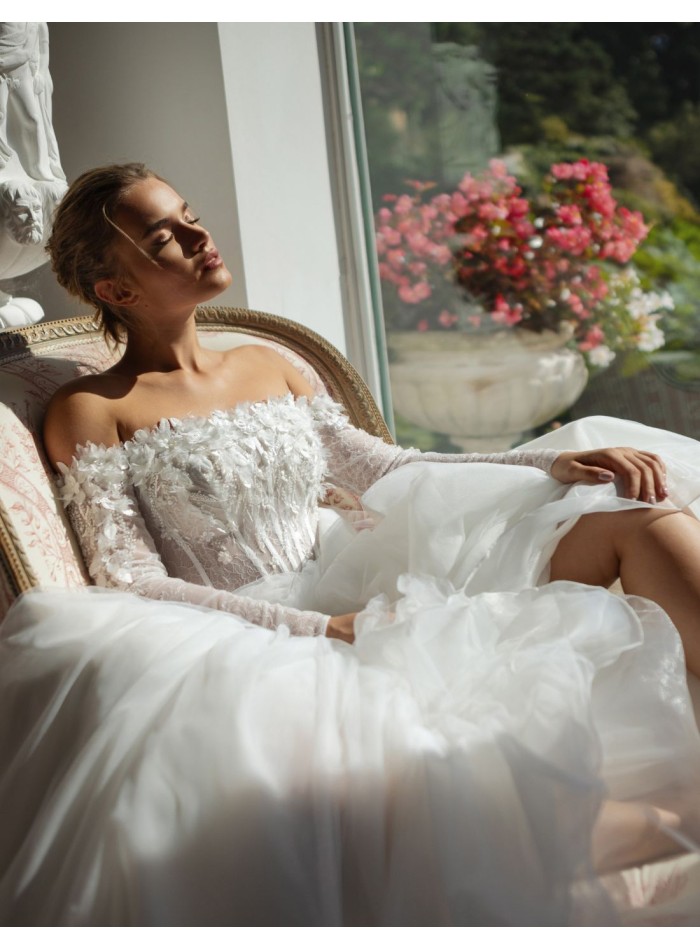 Long ivory wedding dress with lace neckline and...