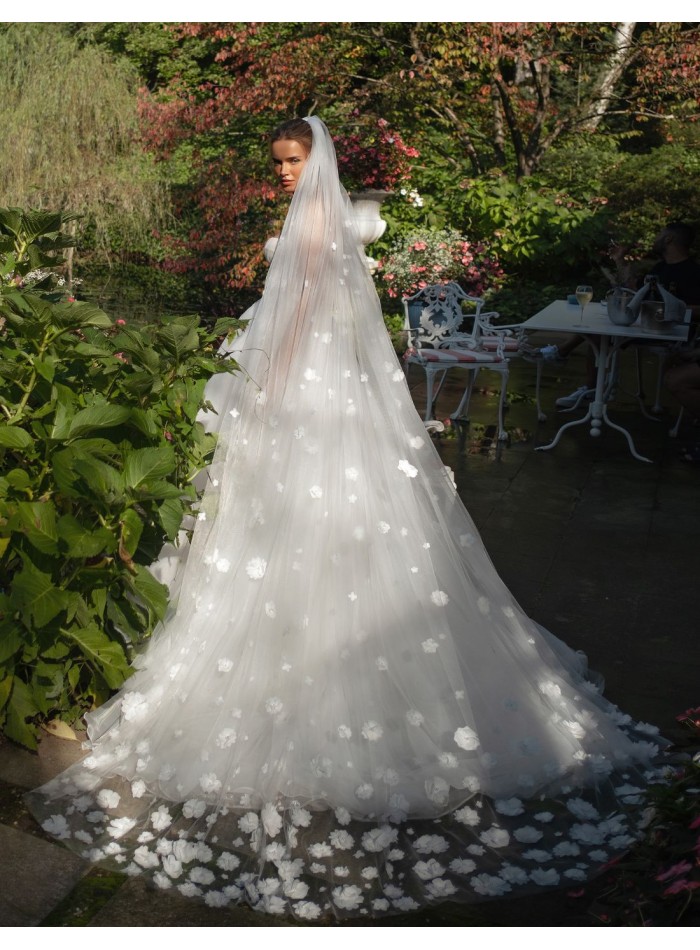 Long wedding dress with bandeau neckline and...