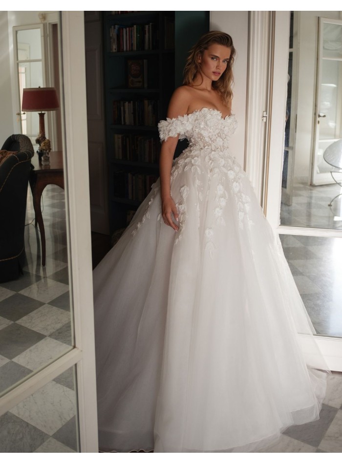 Long wedding dress with bandeau neckline and...
