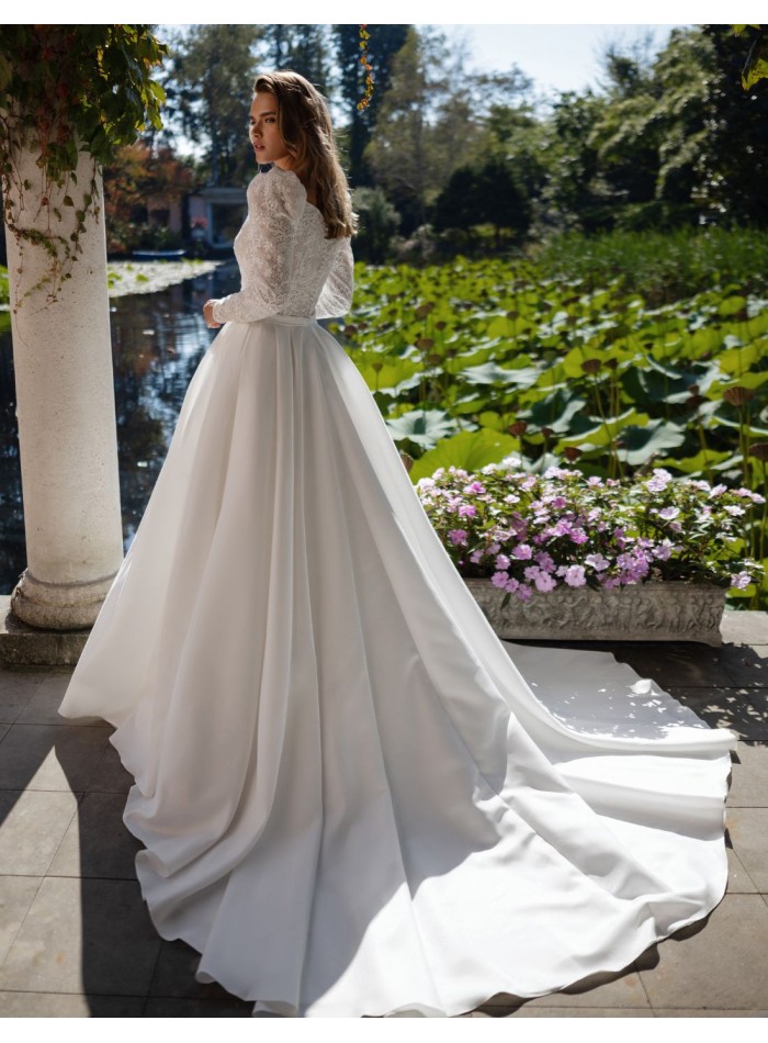 Ivory wedding dress with lace bodice and long...