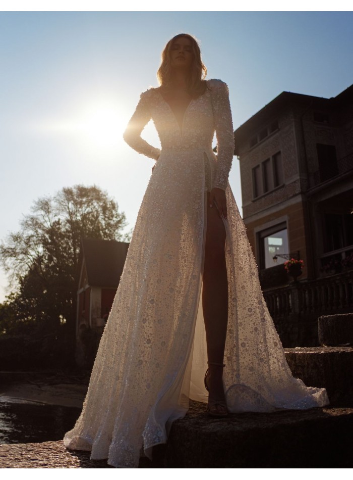 Ivory lace wedding dress with V-neckline and...