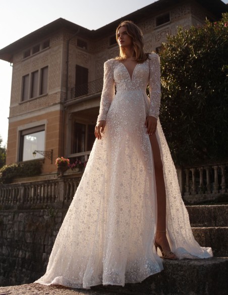 Ivory lace wedding dress with V-neckline and long sleeves