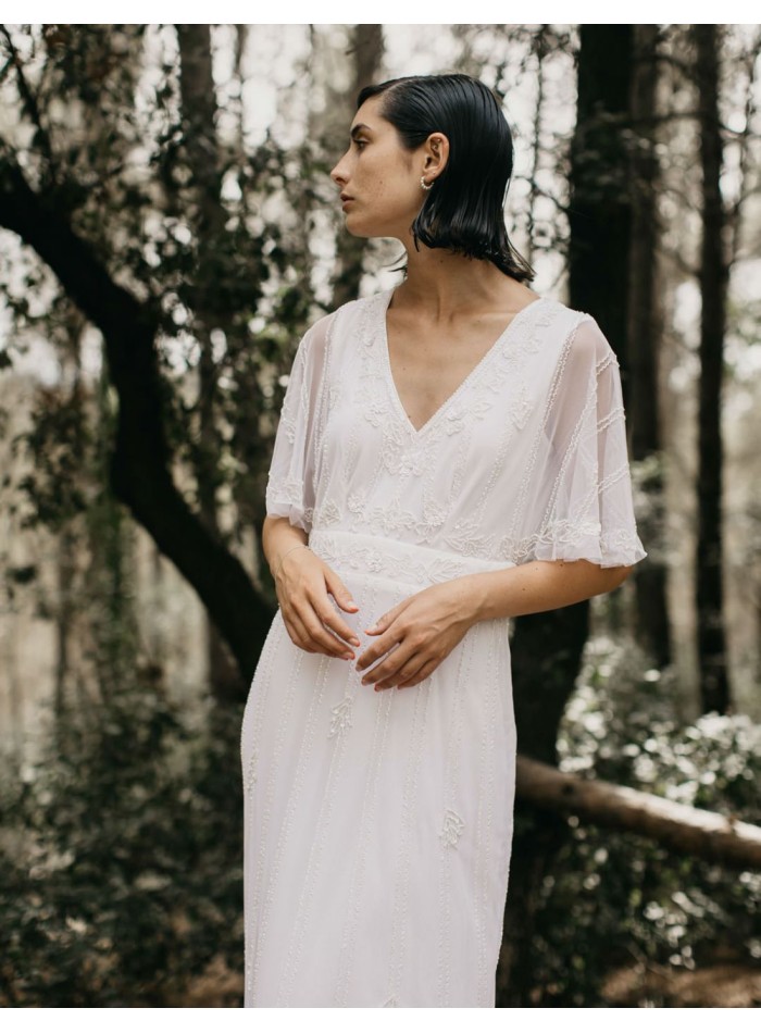 Long white dress with short flowing sleeves