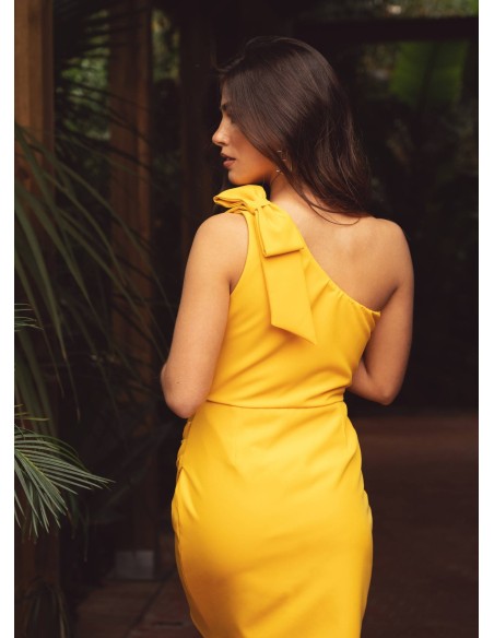 Short yellow dress with asymmetrical neckline and bow detail