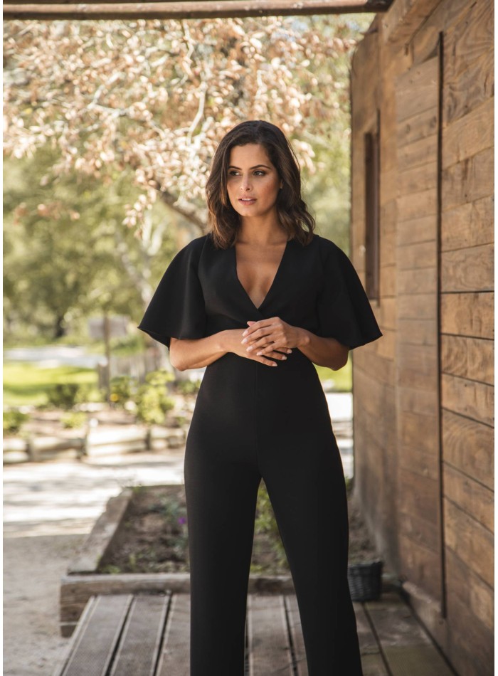 Black long jumpsuit with crossed neckline and...