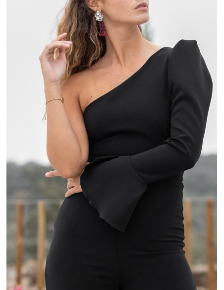 Black party jumpsuit with asymmetric neckline and flounce