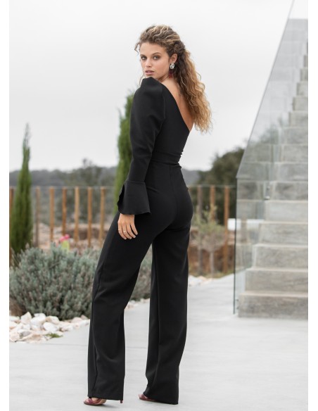 Black party jumpsuit with asymmetric neckline and flounce