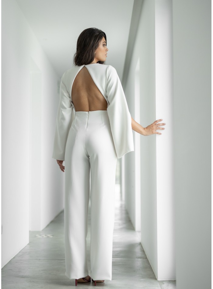 White jumpsuit with puffed sleeves and open back