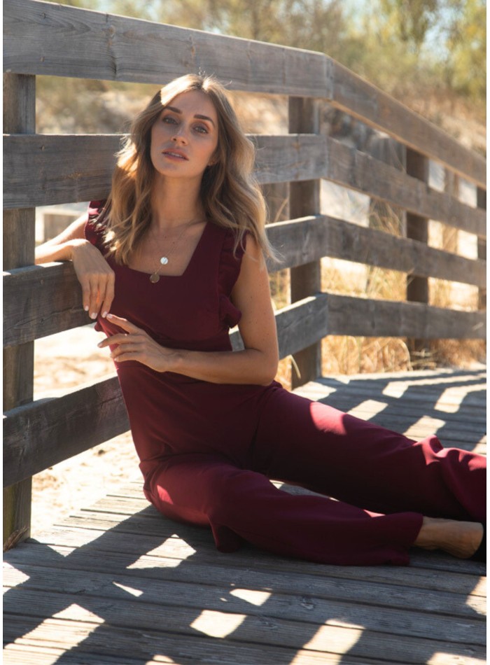 Long burgundy jumpsuit with side slits