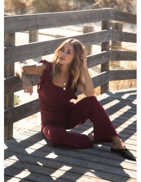 Long burgundy jumpsuit with side slits