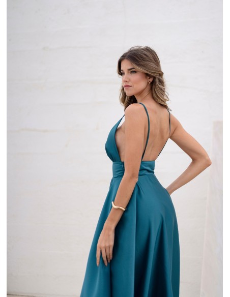Turquoise princess cut dress with plunging neckline