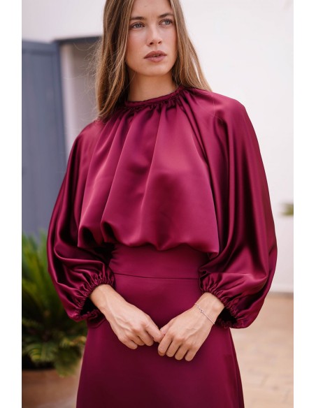 Long sleeve burgundy top with gathered at the waist