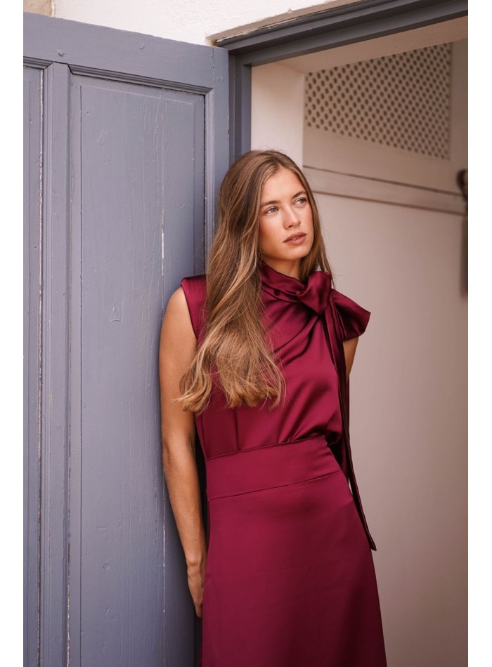 Asymmetrical burgundy top with lacing on one side