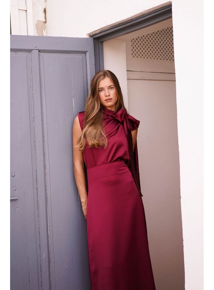 Asymmetrical burgundy top with lacing on one side