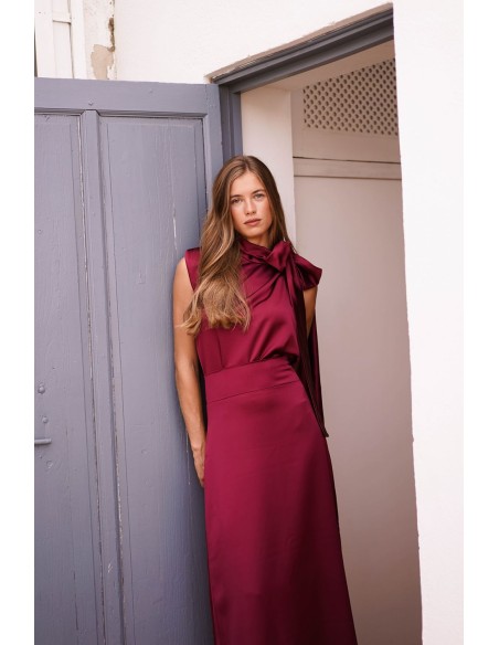 Asymmetrical burgundy top with lacing on one side