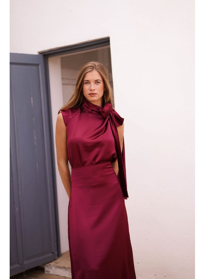Asymmetrical burgundy top with lacing on one side