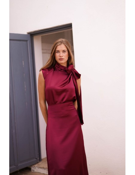 Asymmetrical burgundy top with lacing on one side