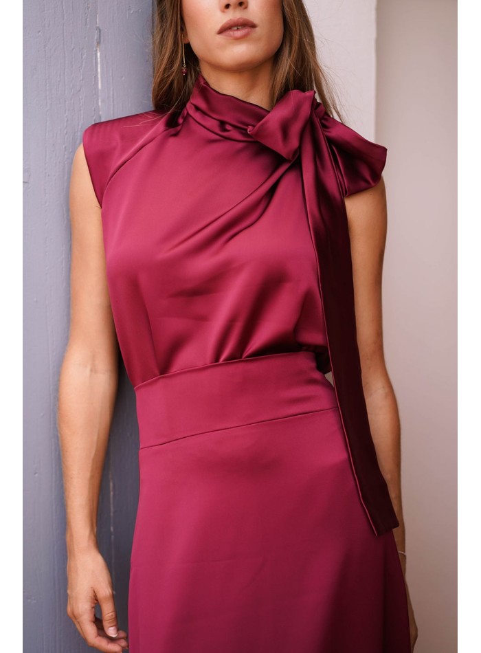 Asymmetrical burgundy top with lacing on one side