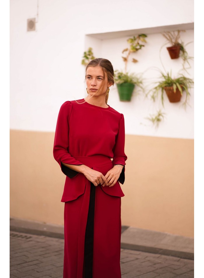 Dark red top with black cuffs and button