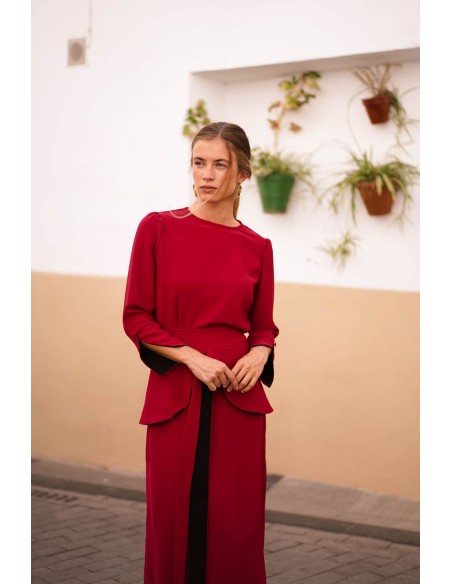 Dark red top with black cuffs and button