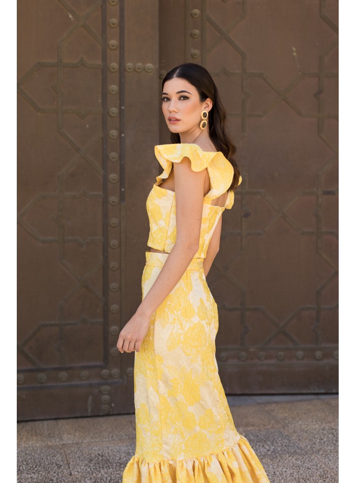 Yellow printed party top with ruffled shoulder...
