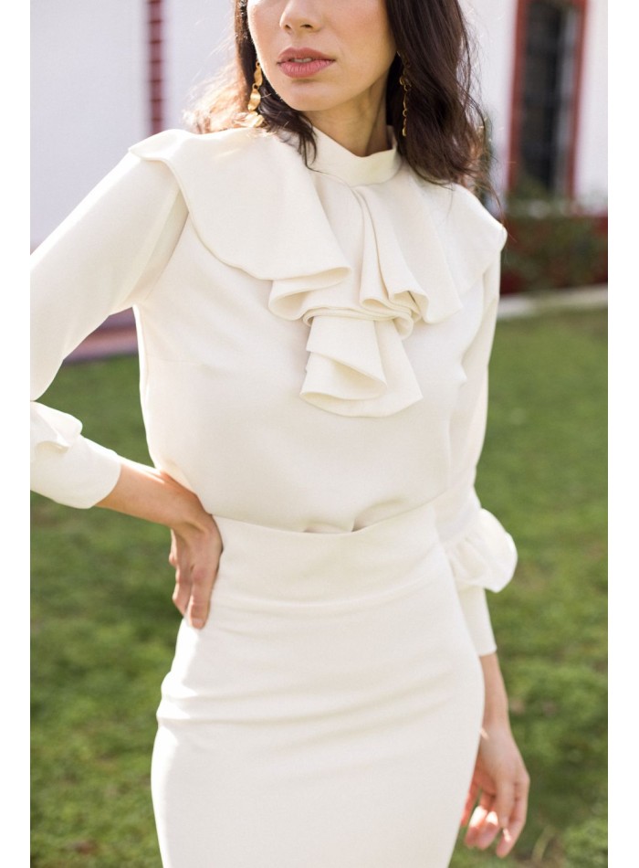 Ecru blouse with ruffled collar and long sleeves