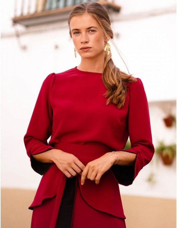 Dark red top with black cuffs and button
