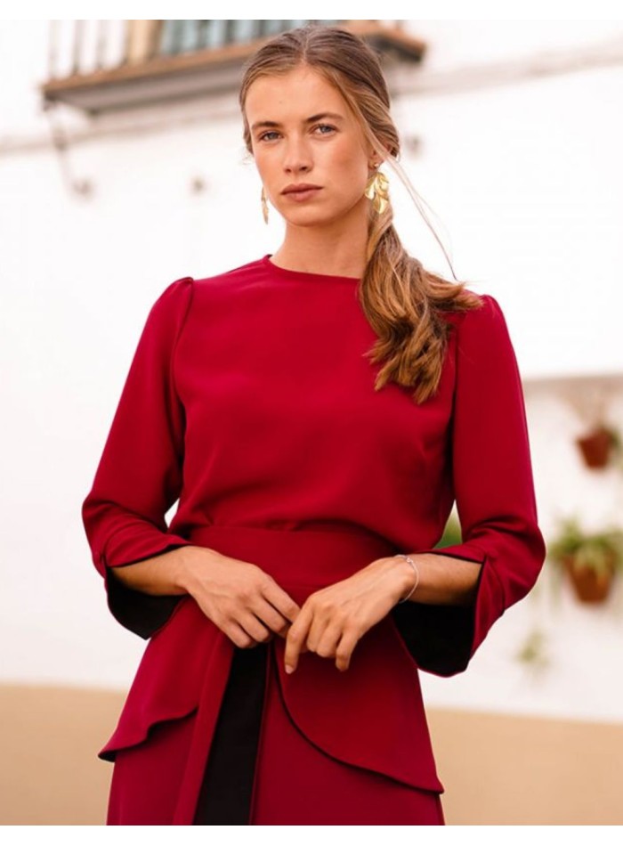 Dark red top with black cuffs and button
