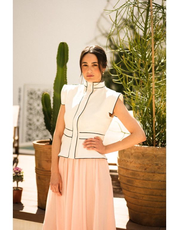 Ecru vest with black piping