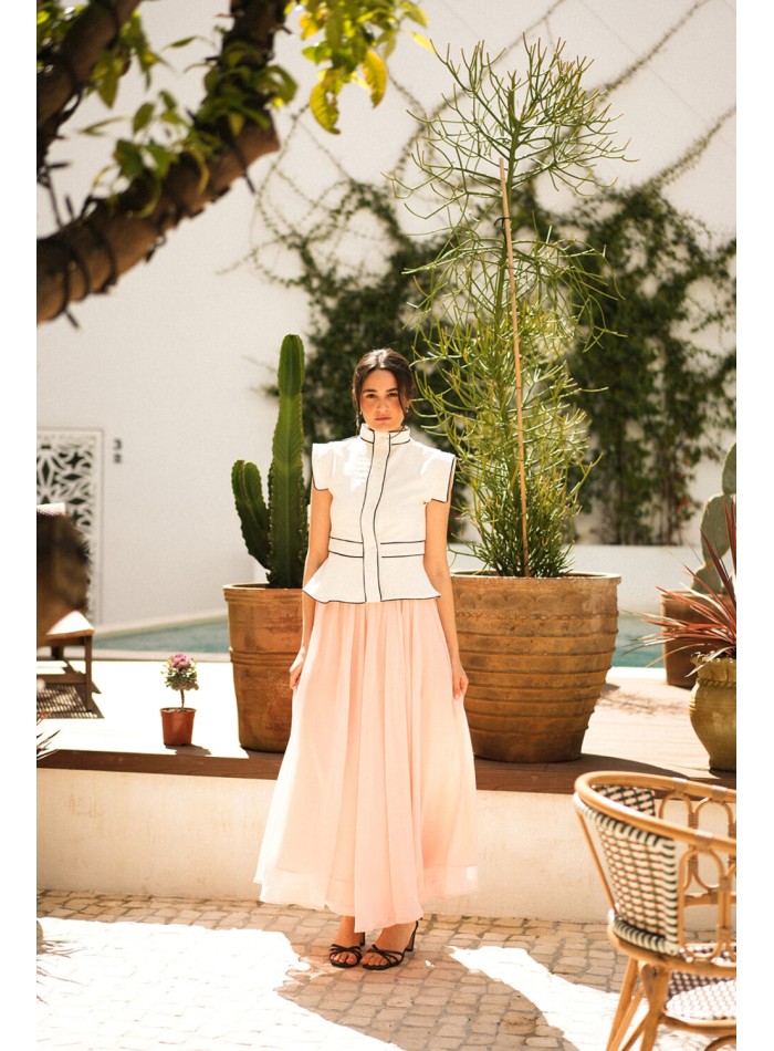 Ecru vest with black piping