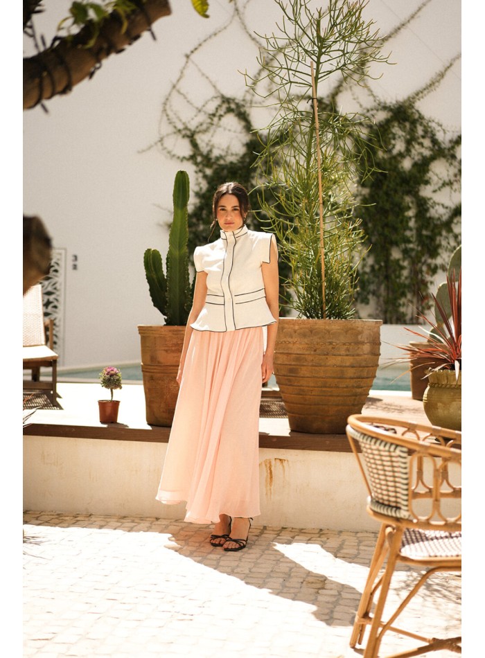 Ecru vest with black piping